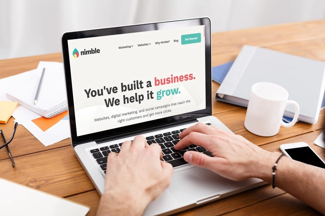 nimble digital website displayed on laptop on wooden desk